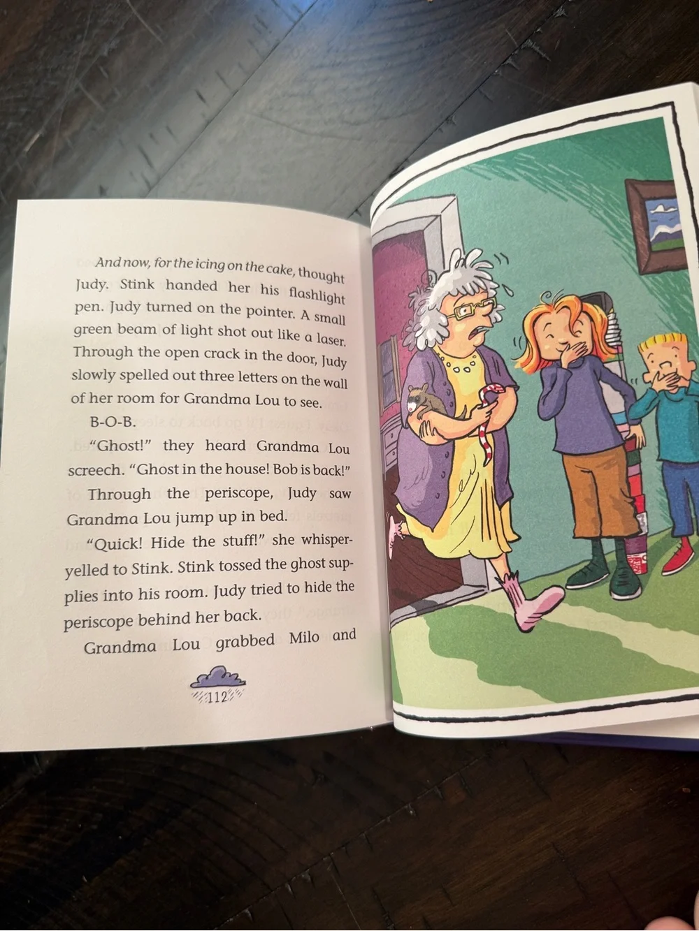 Scholastic Purple Children’s Book Back Cover with Red Umbrella Illustration